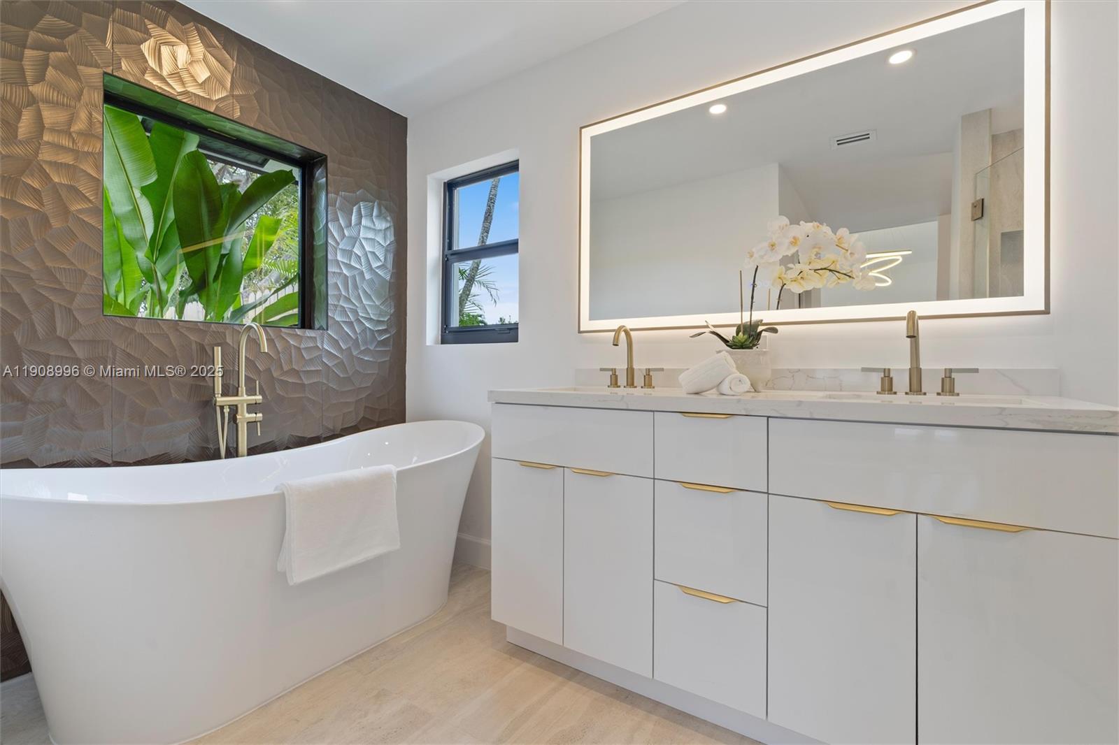 4108 Cedar Creek Road Boca Raton, FL 33487 - Photo 16 of 36 a bathroom with a tub a sink and a large mirror