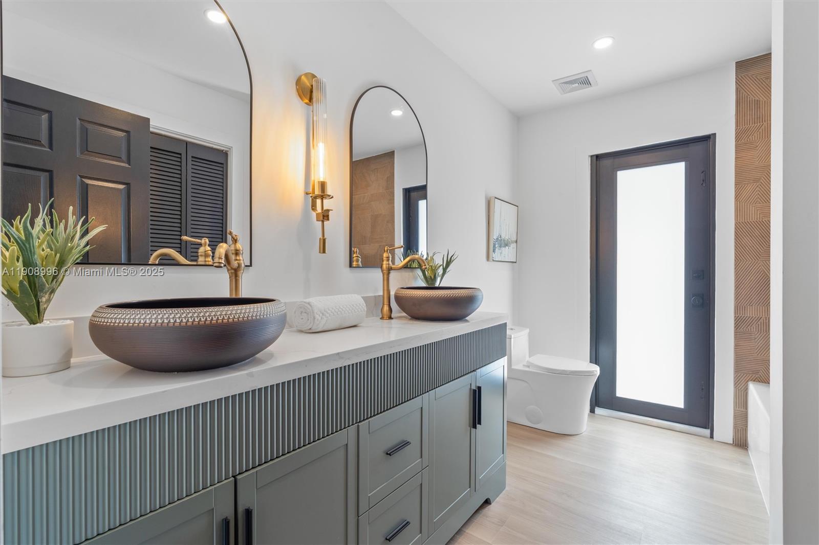 4108 Cedar Creek Road Boca Raton, FL 33487 - Photo 20 of 36 a bathroom with a double vanity sink and a mirror