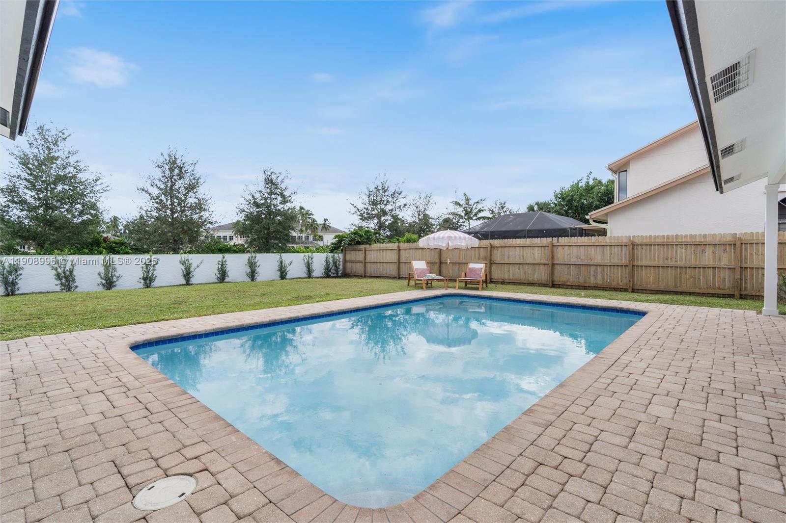 4108 Cedar Creek Road Boca Raton, FL 33487 - Photo 26 of 36 a view of swimming pool with outdoor seating and plants