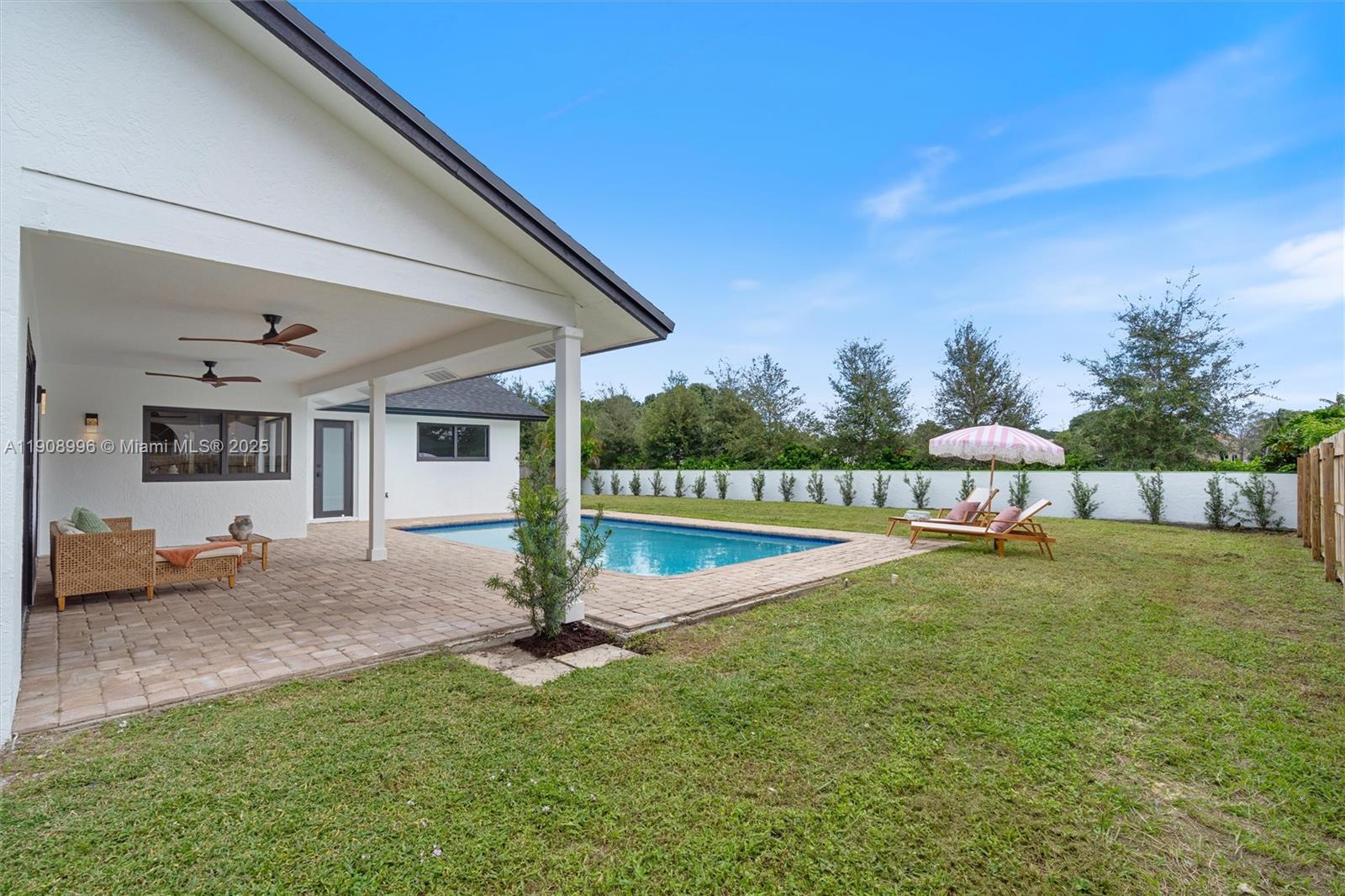 4108 Cedar Creek Road Boca Raton, FL 33487 - Photo 28 of 36 a view of a house with backyard porch and sitting area