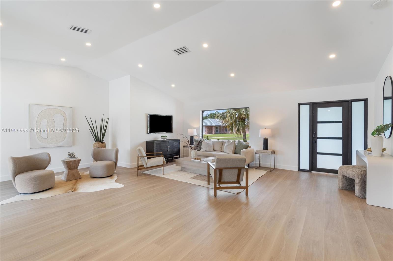 4108 Cedar Creek Road Boca Raton, FL 33487 - Photo 5 of 36 a living room with furniture and a flat screen tv