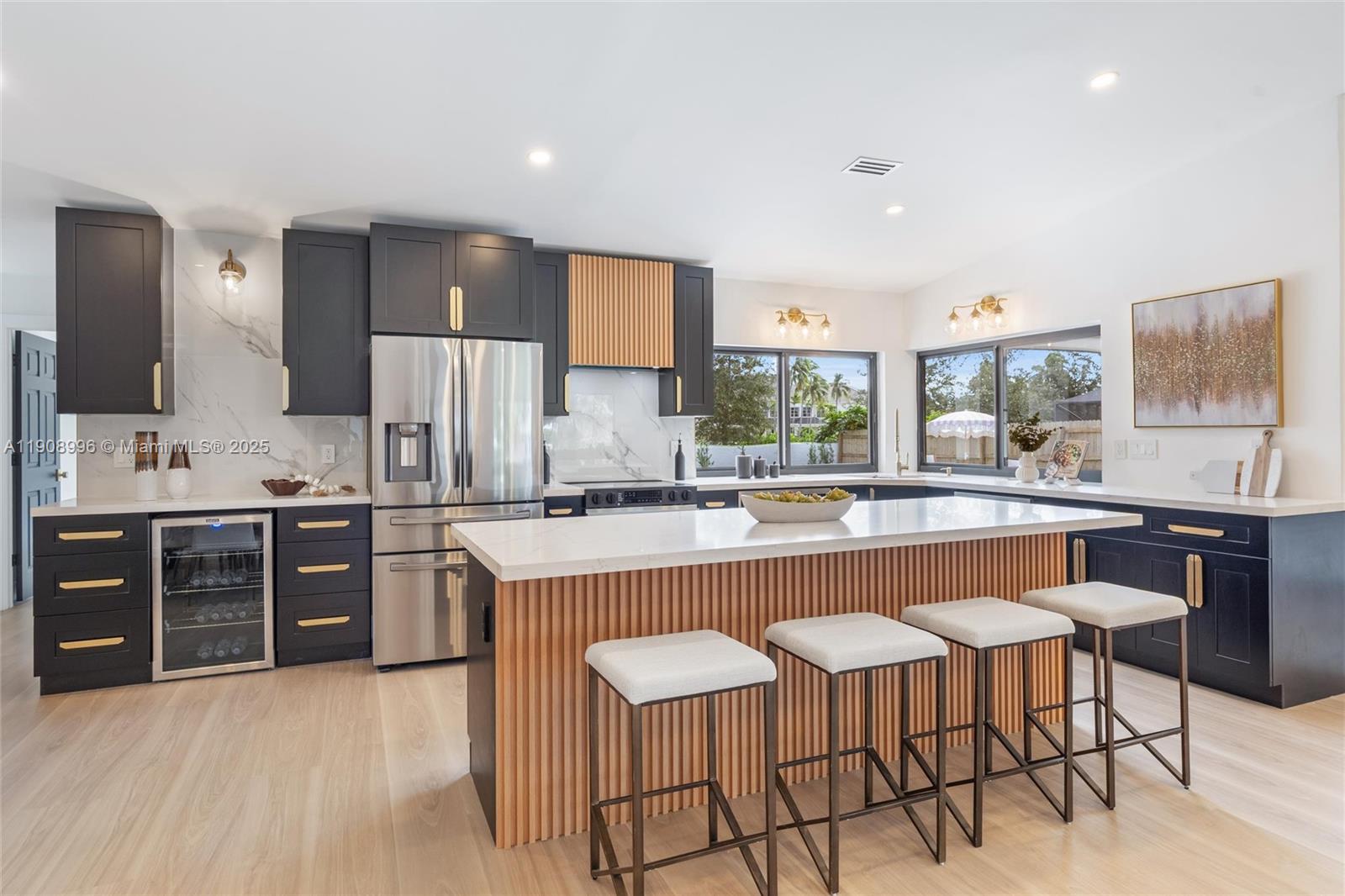 4108 Cedar Creek Road Boca Raton, FL 33487 - Photo 7 of 36 a large kitchen with a table and chairs