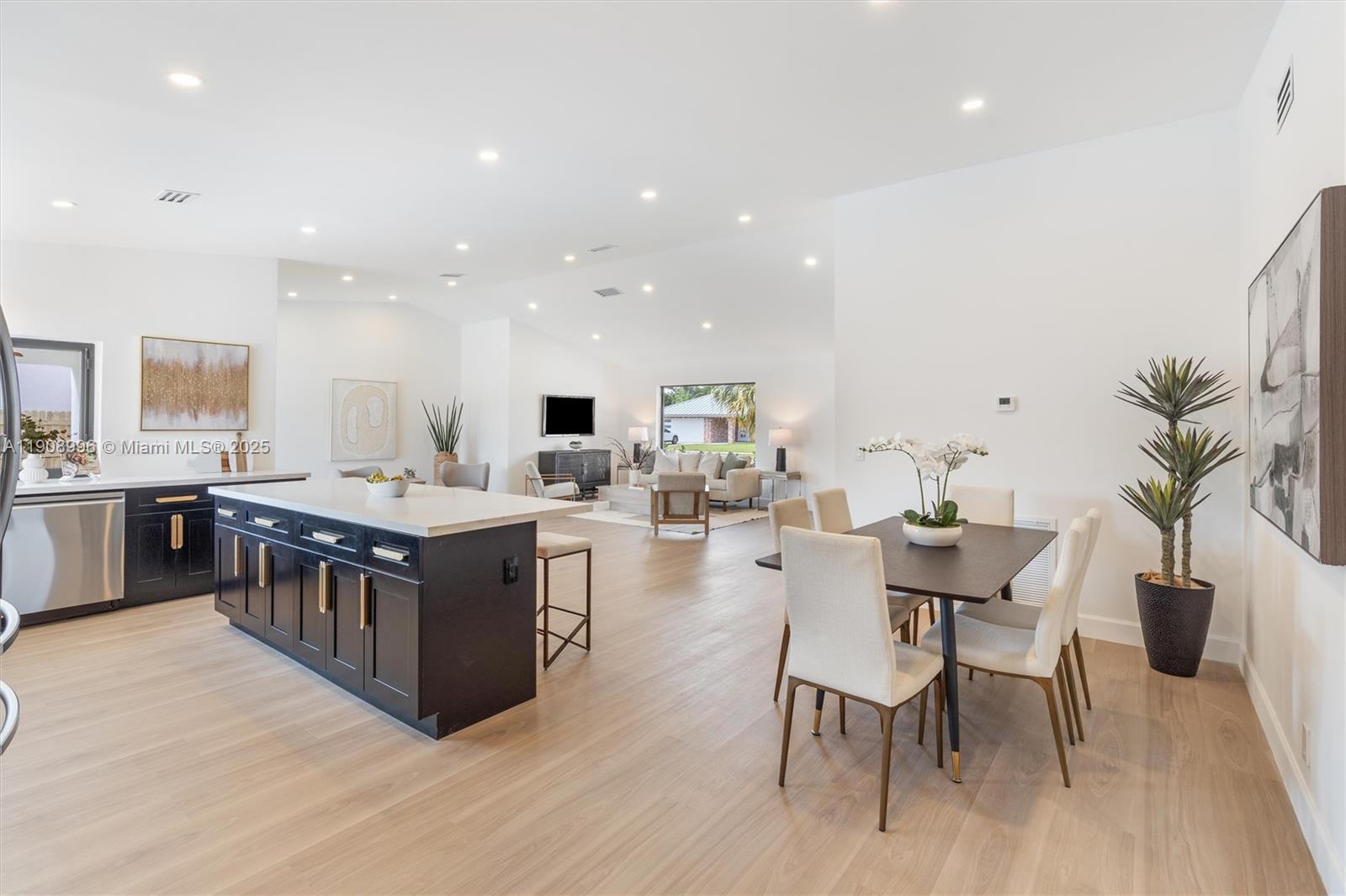 4108 Cedar Creek Road Boca Raton, FL 33487 - Photo 10 of 36 a large kitchen with a table and chairs in it