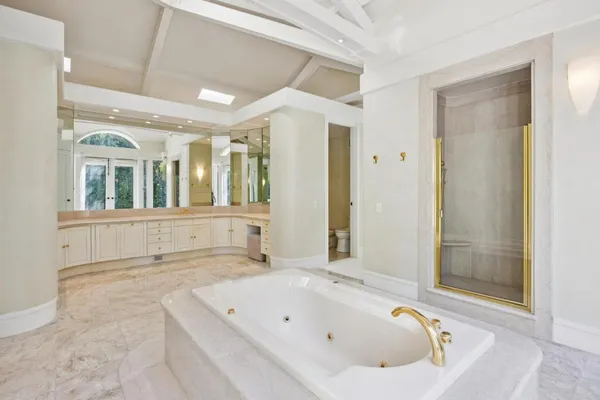 a bathroom with a bathtub and a shower