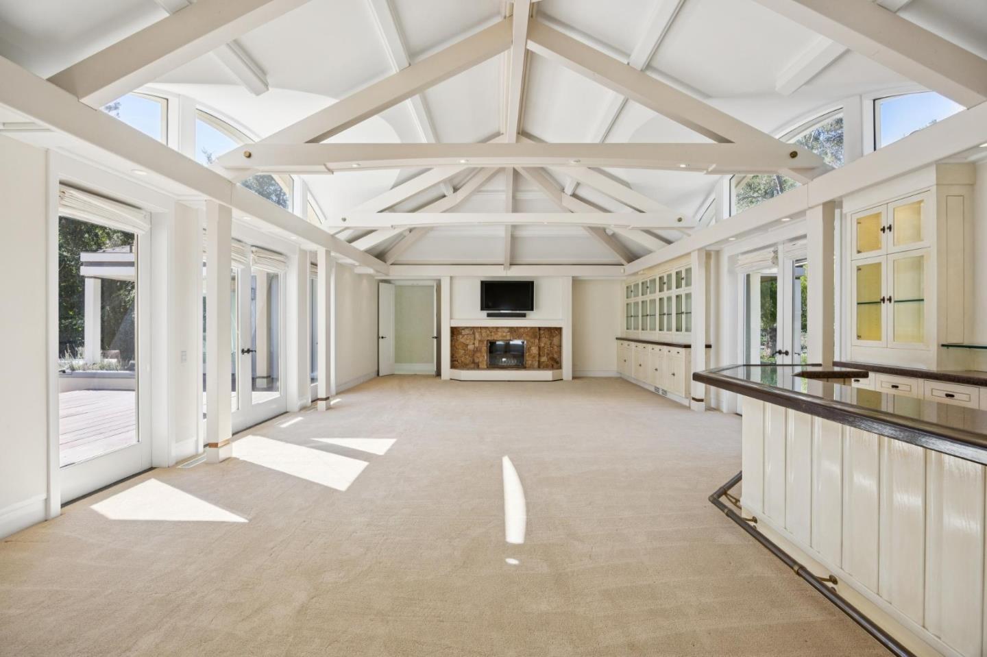 39 Faxon Road Atherton, CA 94027 - Photo 5 of 15 a living room with furniture and a chandelier