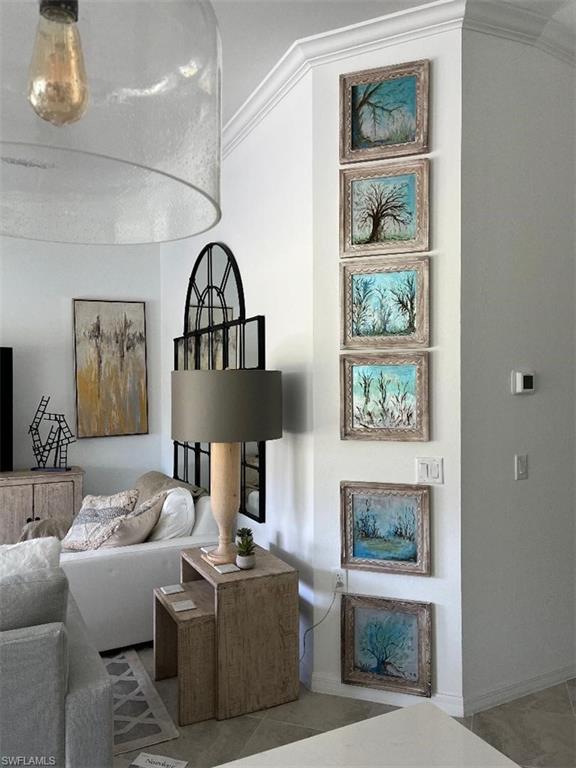 6070 National Blvd Avenue, Unit 226 Immokalee, FL 34142 - Photo 16 of 47 a living room with furniture and a painting on the wall