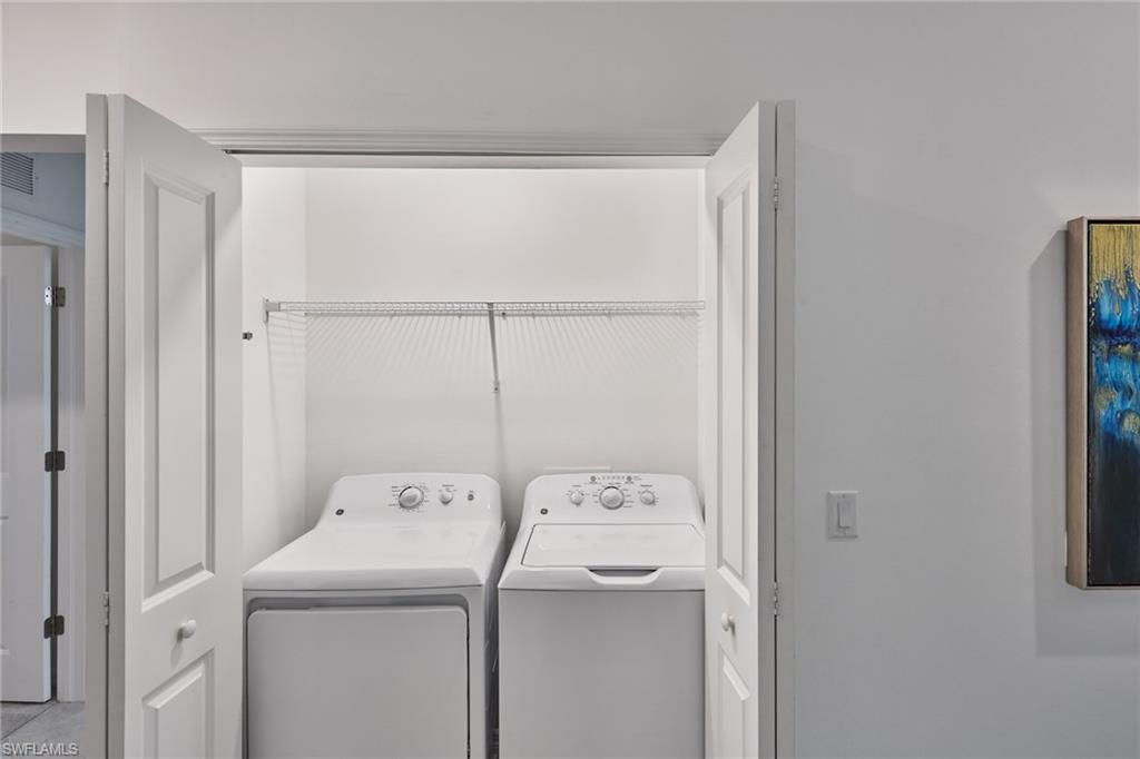 6070 National Blvd Avenue, Unit 226 Immokalee, FL 34142 - Photo 19 of 47 a utility room with dryer and washer