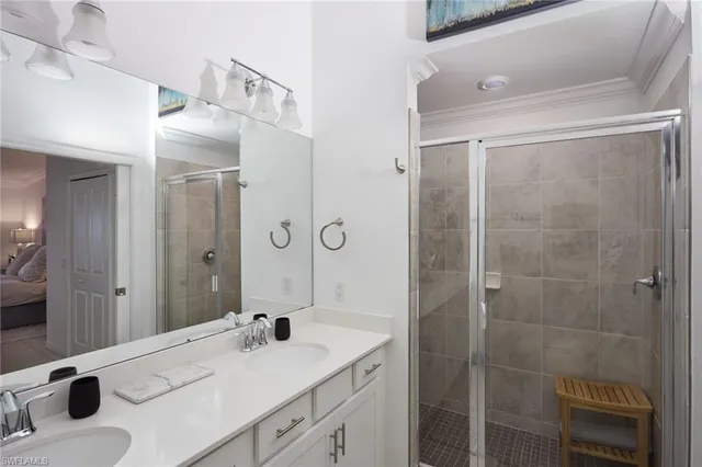 a bathroom with a sink double vanity and a mirror