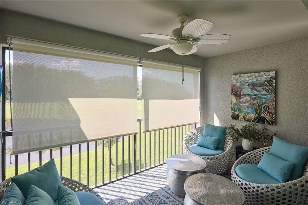 6070 National Blvd Avenue, Unit 226 Immokalee, FL 34142 - Photo 4 of 47 a living room with furniture and a chandelier