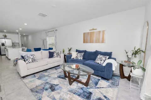 a living room with furniture and a couch