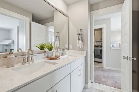 a kitchen with sink refrigerator and microwave