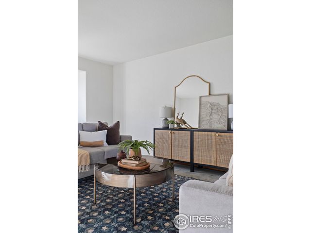 a living room with furniture and window