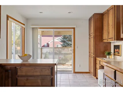 a kitchen with a window a sink and a cabinets