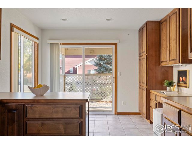 a kitchen with a window a sink and a cabinets