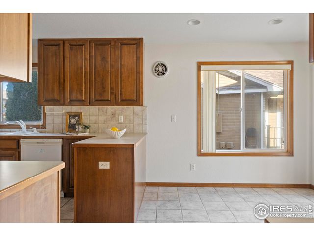 a kitchen with a refrigerator stove and sink