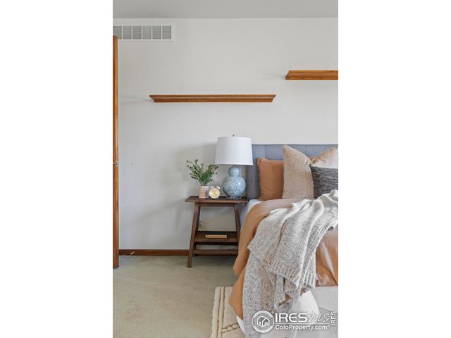 a view of a room with a bed and a couch