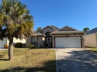 a front view of a house with yard