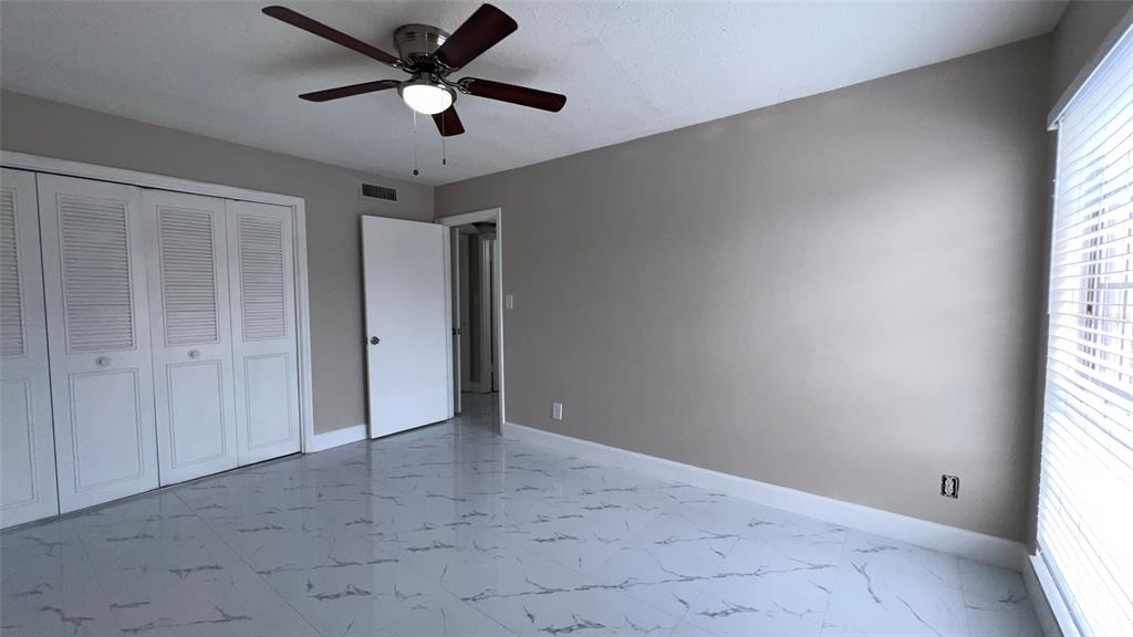 305 Wymore Road, Unit 203 Altamonte Springs, FL 32714 - Photo 15 of 21 a view of an empty room and window