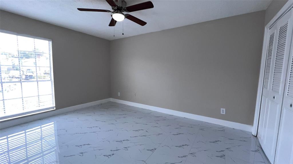 305 Wymore Road, Unit 203 Altamonte Springs, FL 32714 - Photo 16 of 21 en empty room with windows