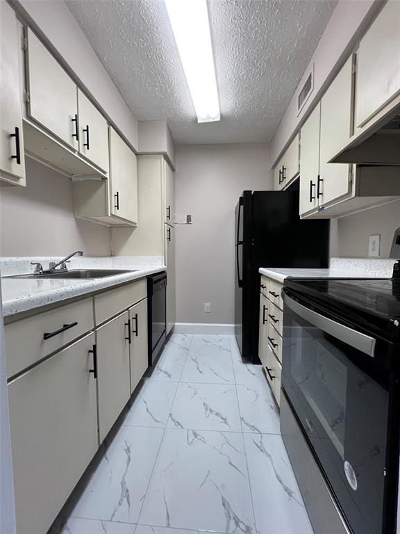 305 Wymore Road, Unit 203 Altamonte Springs, FL 32714 - Photo 9 of 21 a kitchen with stainless steel appliances kitchen island a sink stove and cabinets