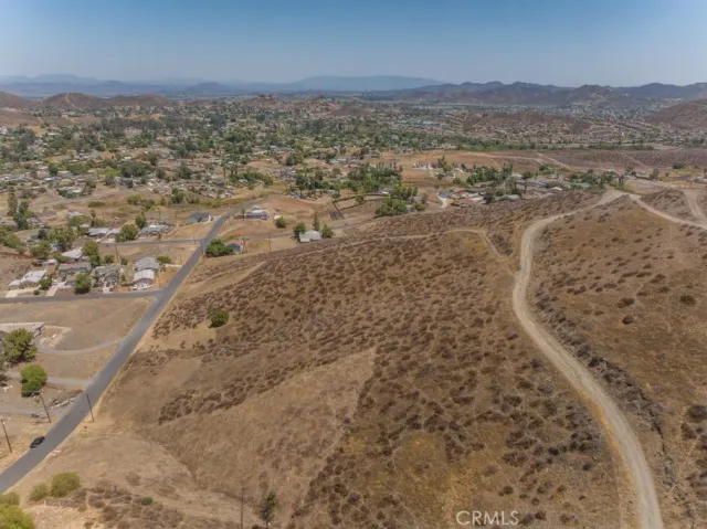 a view of a mountain with wooden fence