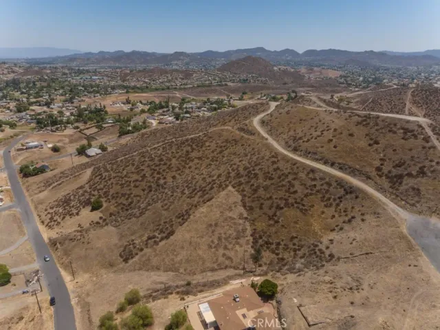 a view of a mountain with wooden fence