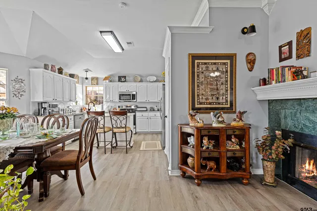 a dining room with furniture and wooden floor