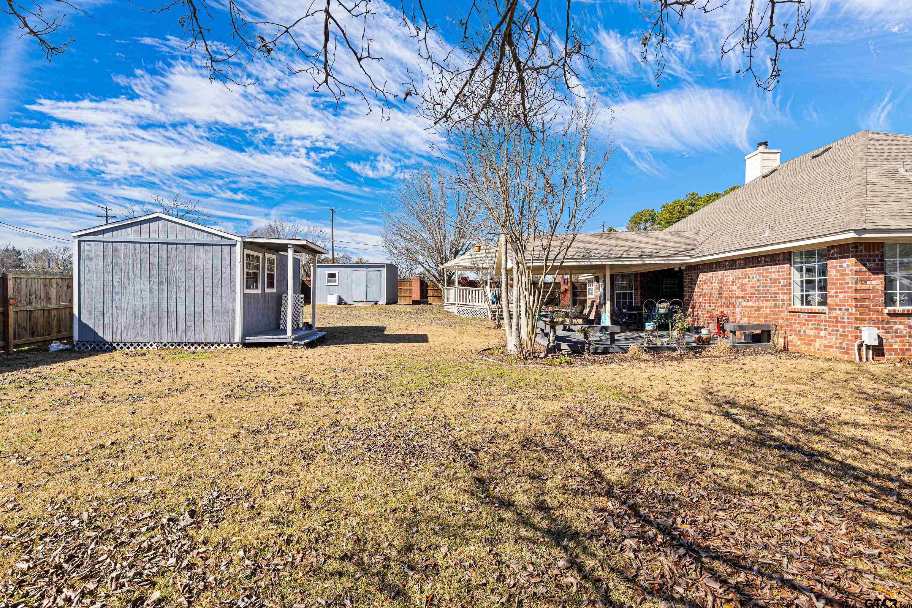 102 Fairway Street Chandler, TX 75758 - Photo 30 of 33 a view of a house with a yard covered in snow