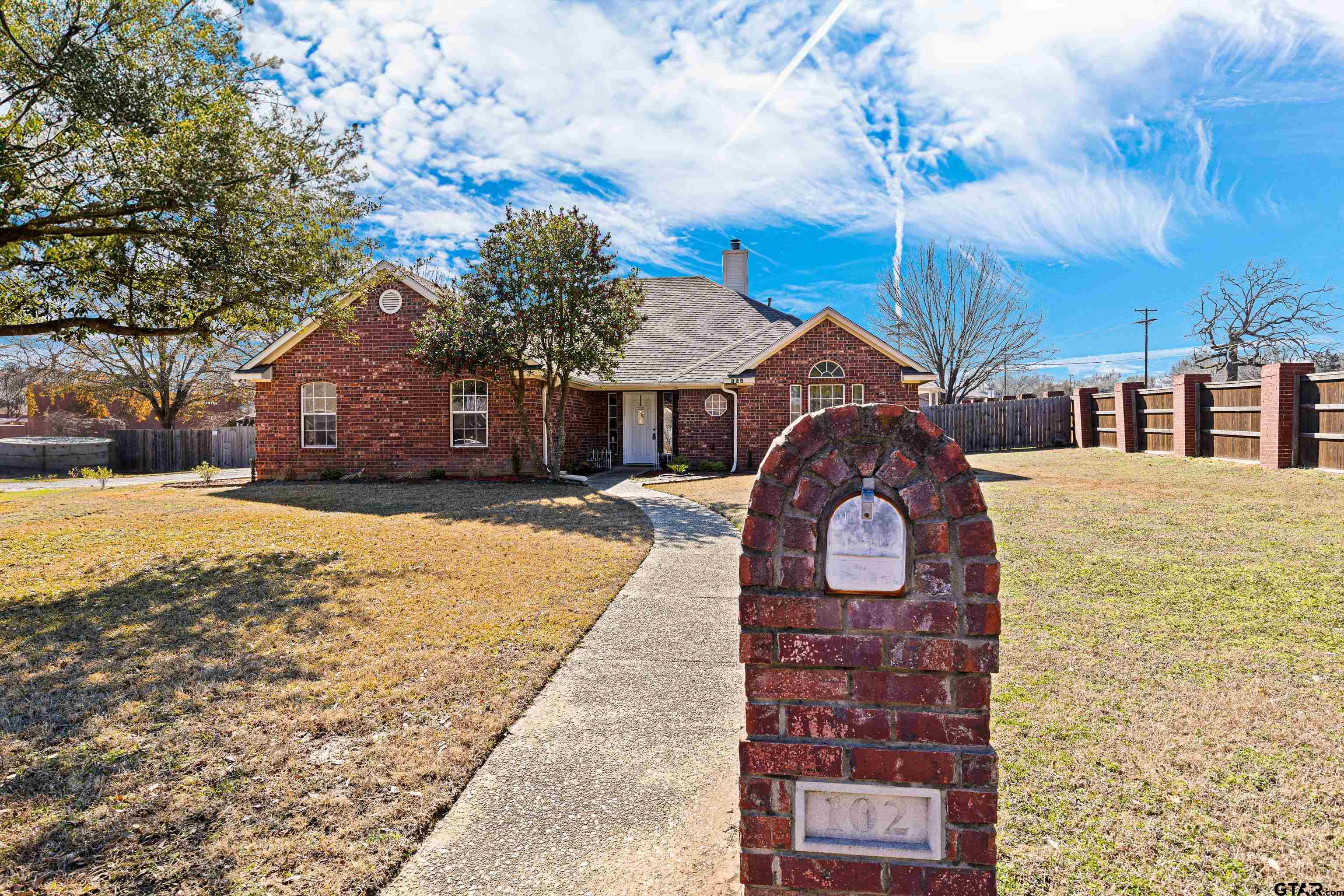 102 Fairway Street Chandler, TX 75758 - Photo 3 of 33 a front view of a house with a yard