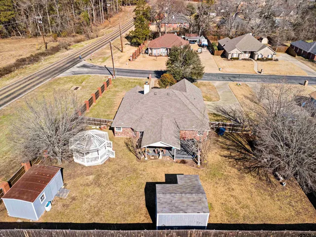 an aerial view of a house with a ocean view