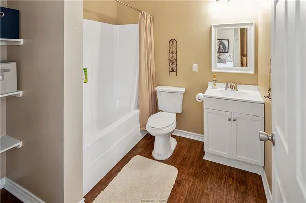 a bathroom with a toilet and a sink