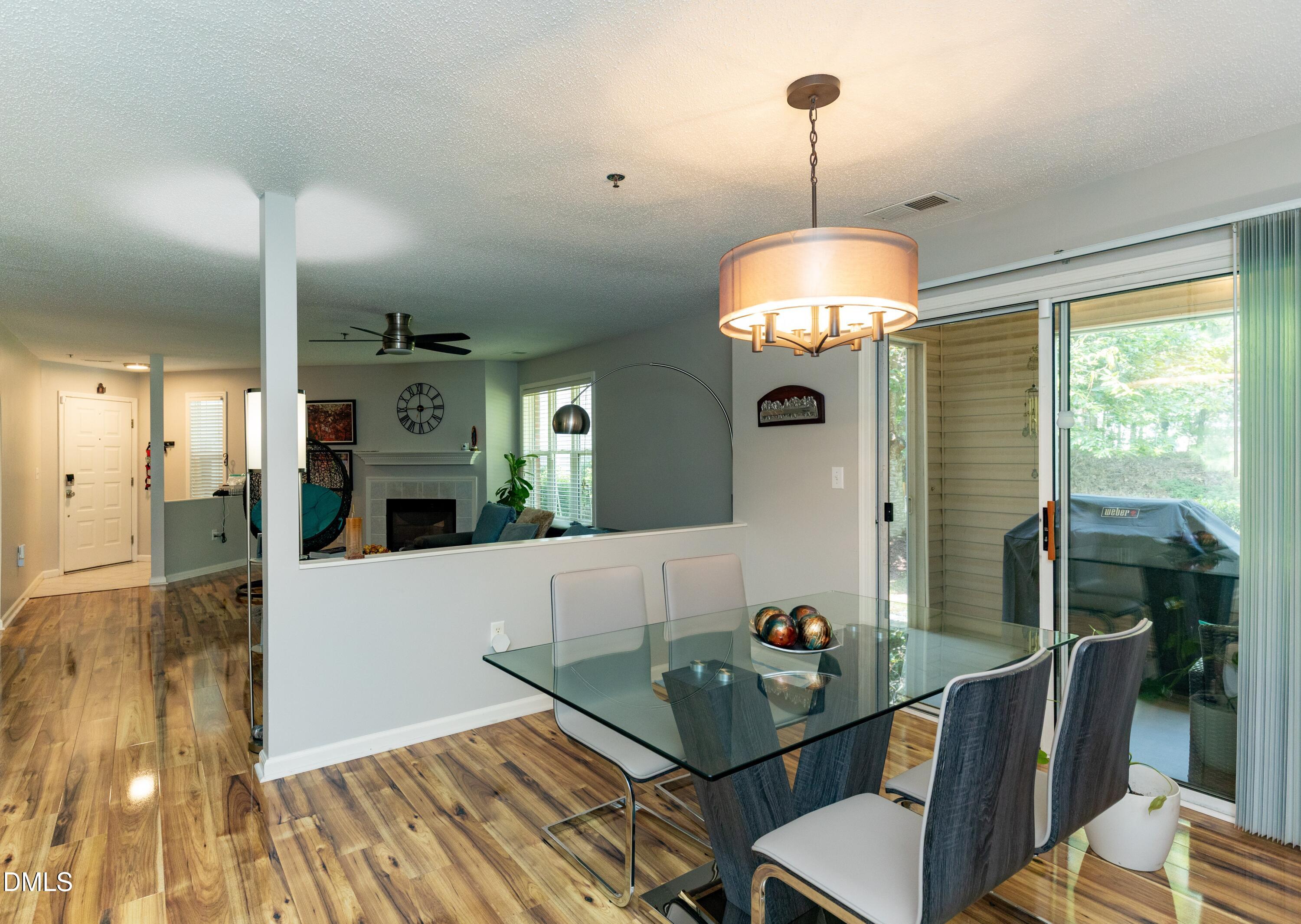 1911 Falls Landing Drive, Unit 103 Raleigh, NC 27614 - Photo 1 of 28 a living room with furniture and a table