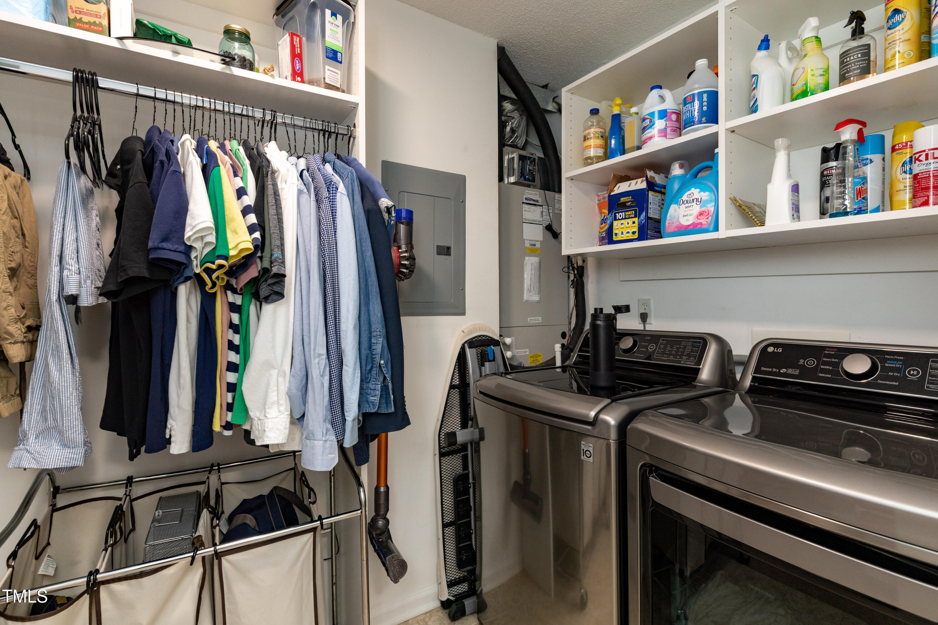 1911 Falls Landing Drive, Unit 103 Raleigh, NC 27614 - Photo 11 of 28 a view of walk in closet with clothes and shoes