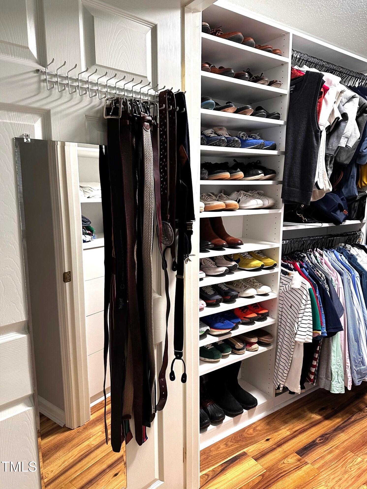 1911 Falls Landing Drive, Unit 103 Raleigh, NC 27614 - Photo 16 of 28 a view of walk in closet with clothes and shoes