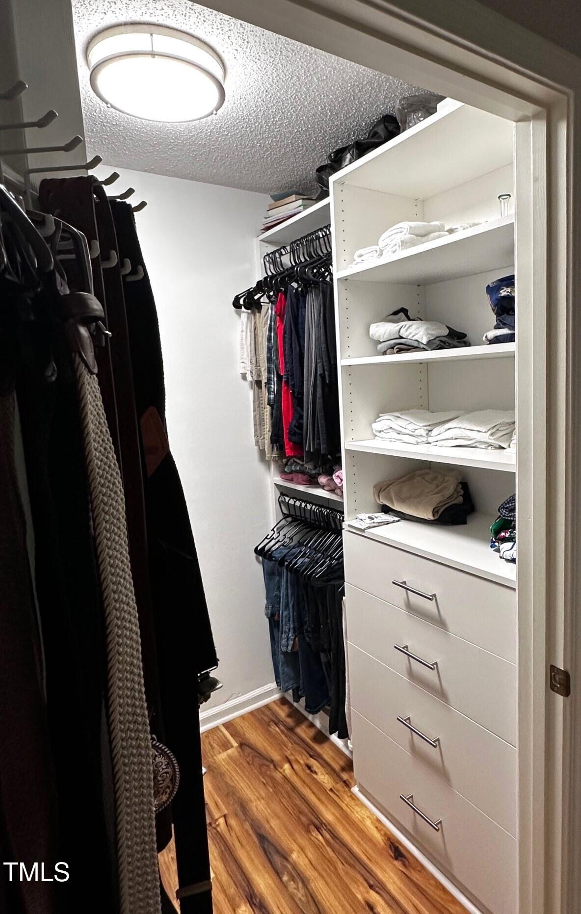1911 Falls Landing Drive, Unit 103 Raleigh, NC 27614 - Photo 17 of 28 a view of a closet with storage