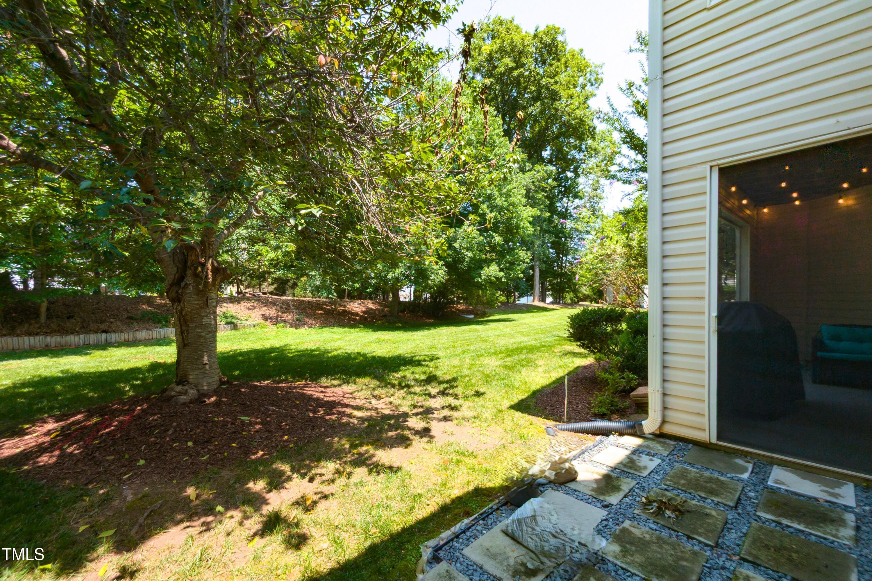 1911 Falls Landing Drive, Unit 103 Raleigh, NC 27614 - Photo 23 of 28 a view of a garden with an outdoor space