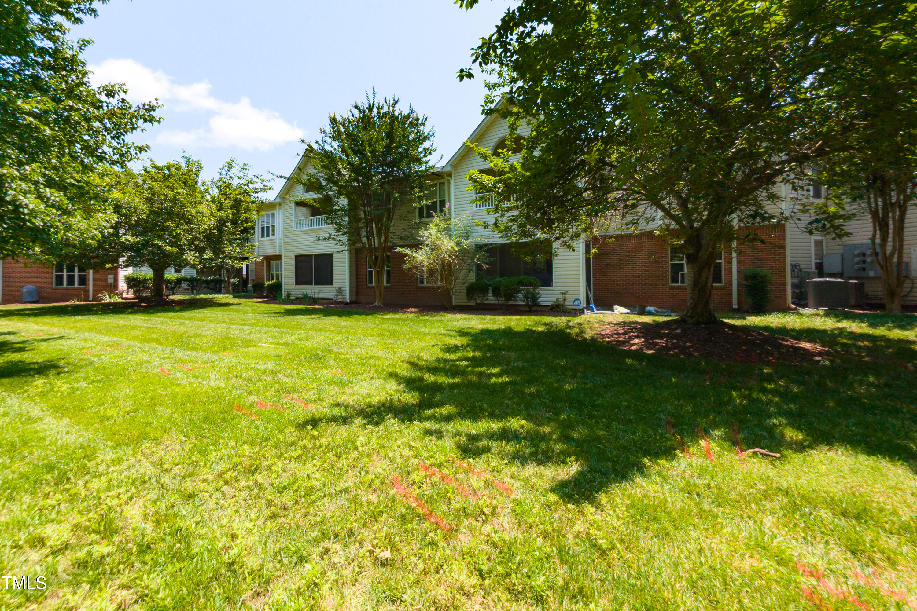 1911 Falls Landing Drive, Unit 103 Raleigh, NC 27614 - Photo 24 of 28 a view of a house with a yard patio and fire pit