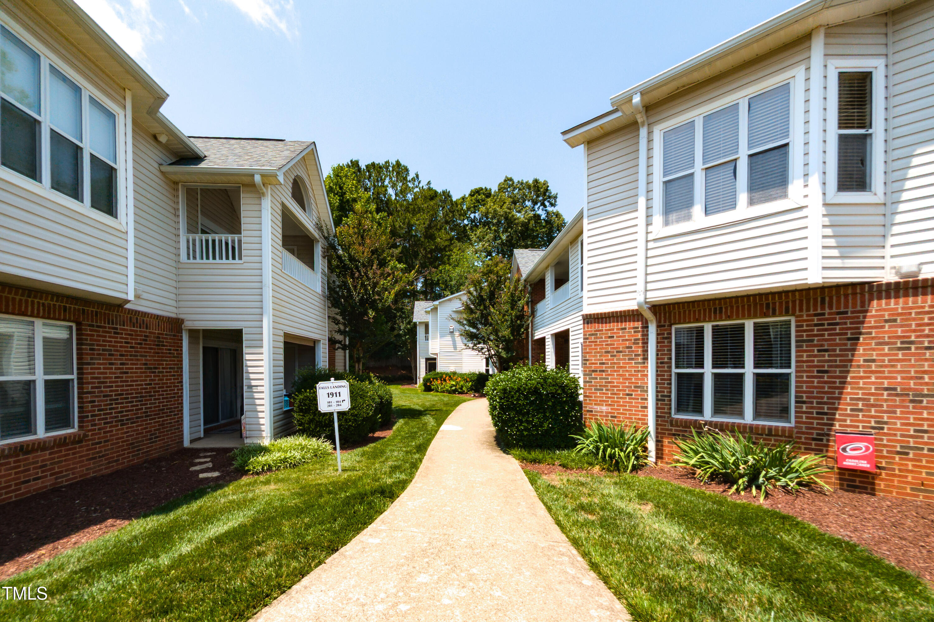 1911 Falls Landing Drive, Unit 103 Raleigh, NC 27614 - Photo 3 of 28 a view of a house with a yard and plants
