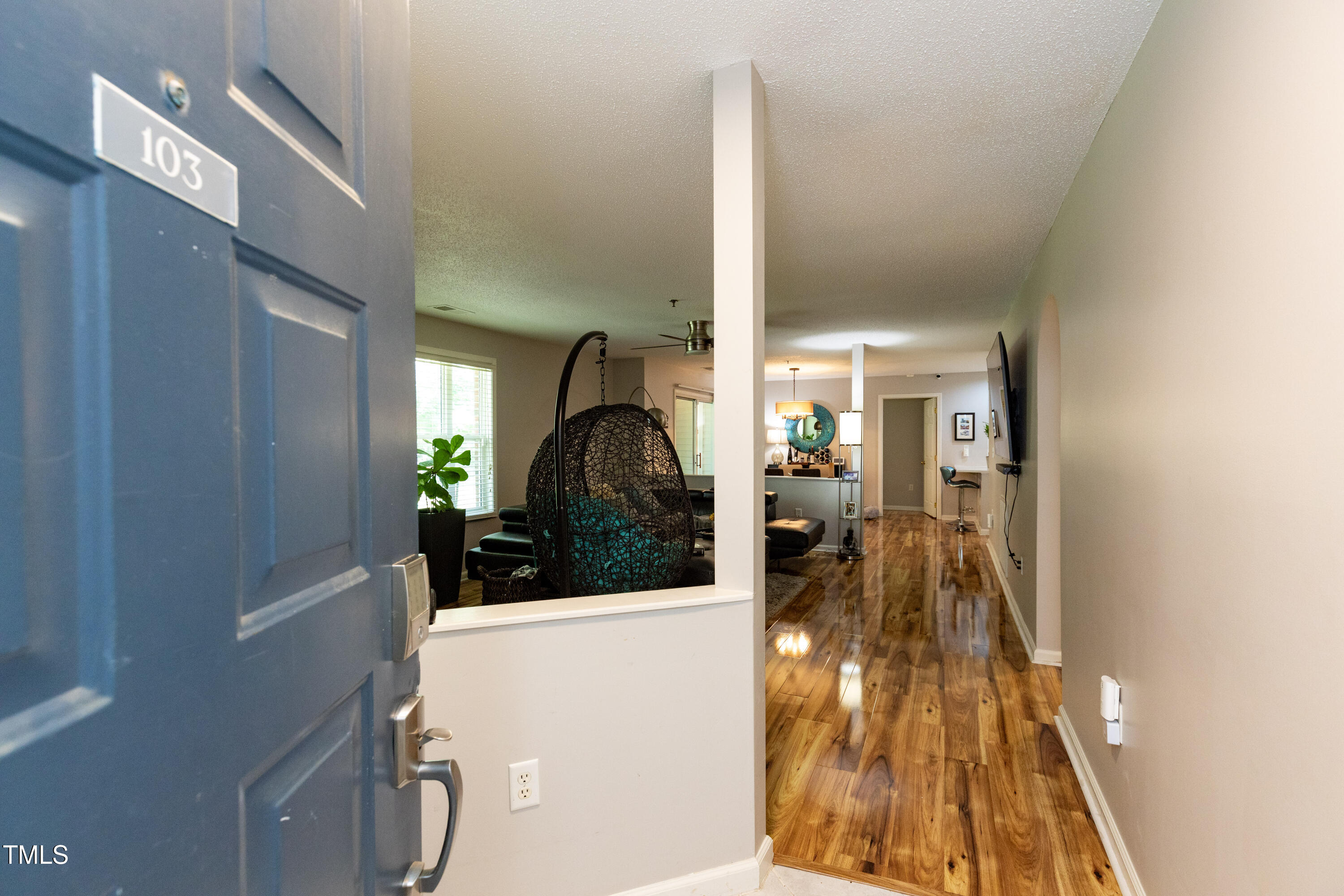 1911 Falls Landing Drive, Unit 103 Raleigh, NC 27614 - Photo 4 of 28 a view of a living room and a balcony