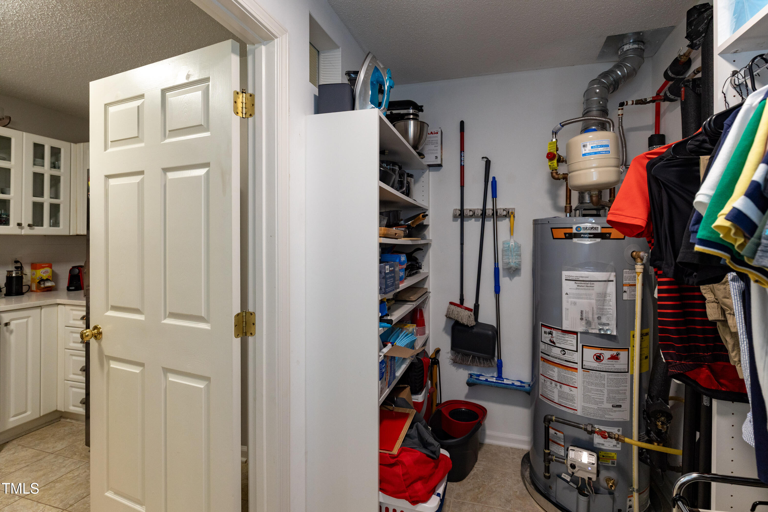 1911 Falls Landing Drive, Unit 103 Raleigh, NC 27614 - Photo 10 of 28 a view of walk in closet with clothes and shoes
