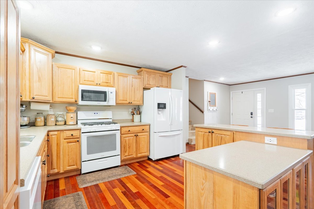 112 Gregory Lane Lexington, IL 61753 - Photo 6 of 39 a kitchen with stainless steel appliances a refrigerator sink and stove