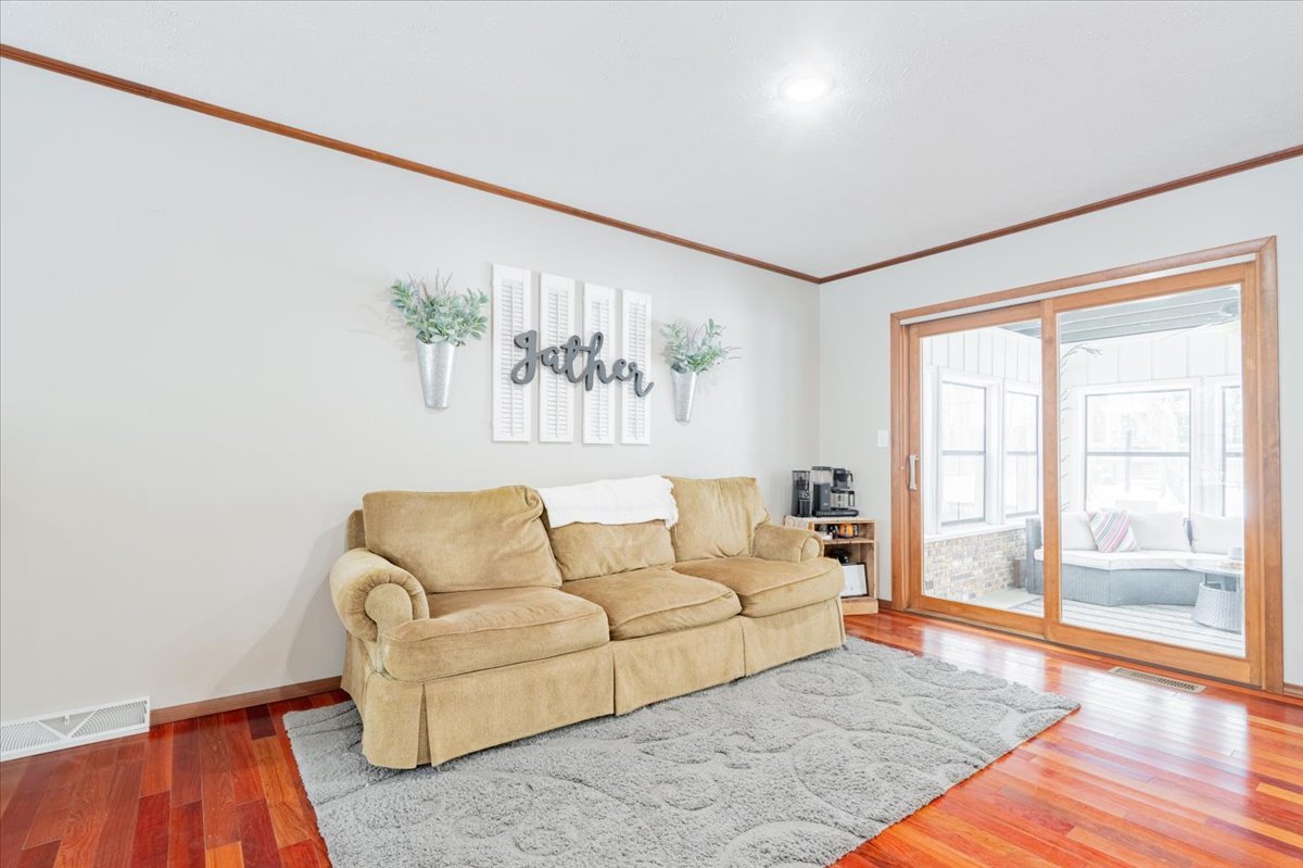 112 Gregory Lane Lexington, IL 61753 - Photo 8 of 39 a living room with furniture and a large window