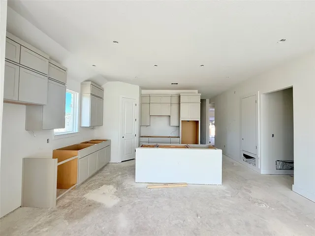 a view of an empty room with a fireplace