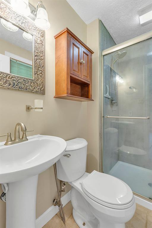 171 Dehaven Road Beaver Falls, PA 15010 - Photo 16 of 35 a bathroom with a sink a toilet and shower