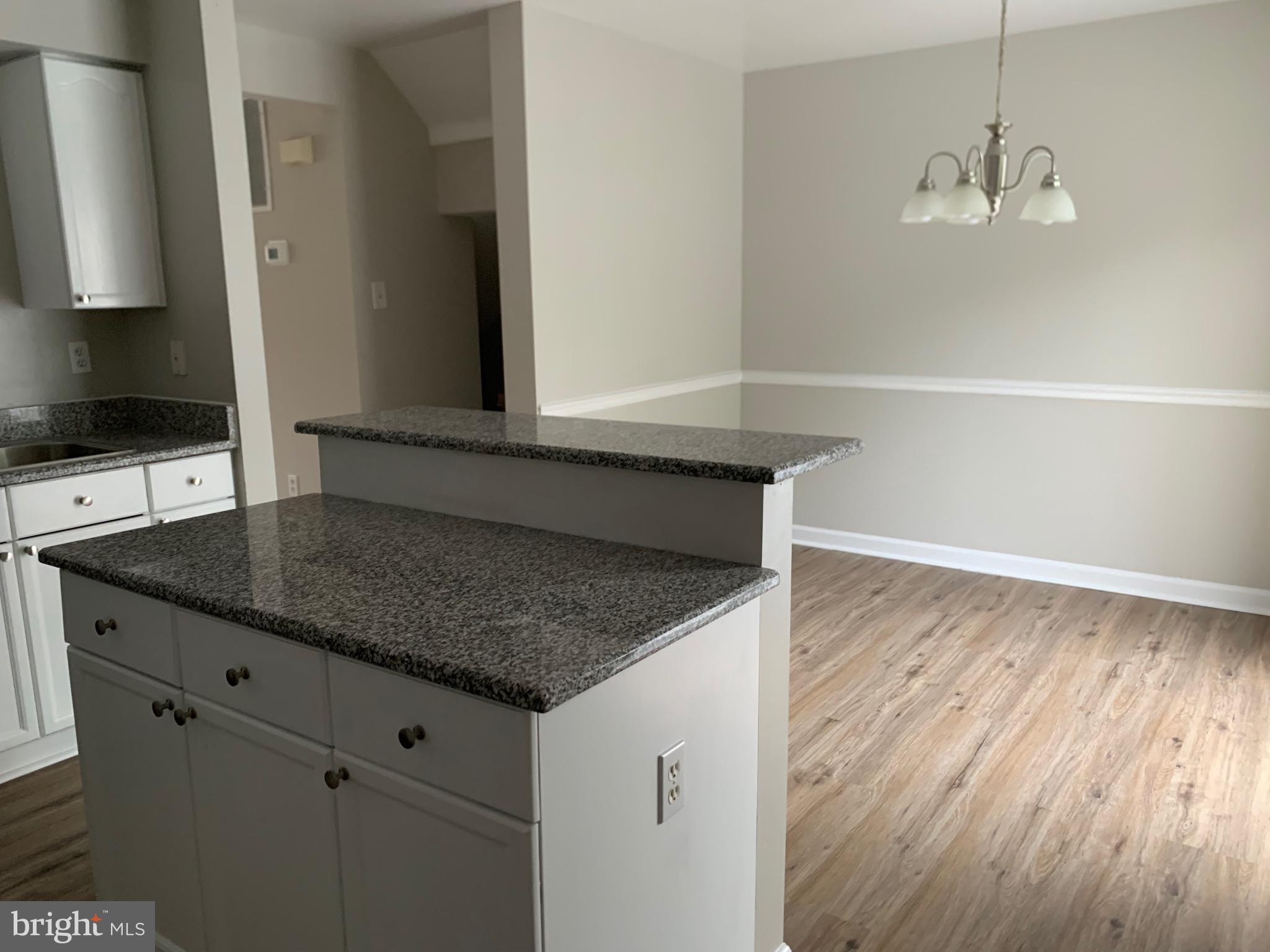 114 Sentry Ridge Smithsburg, MD 21783 - Photo 8 of 60 a kitchen with granite countertop a sink and a stove