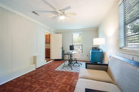 a living room with furniture and a table