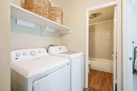 a utility room with dryer and washer