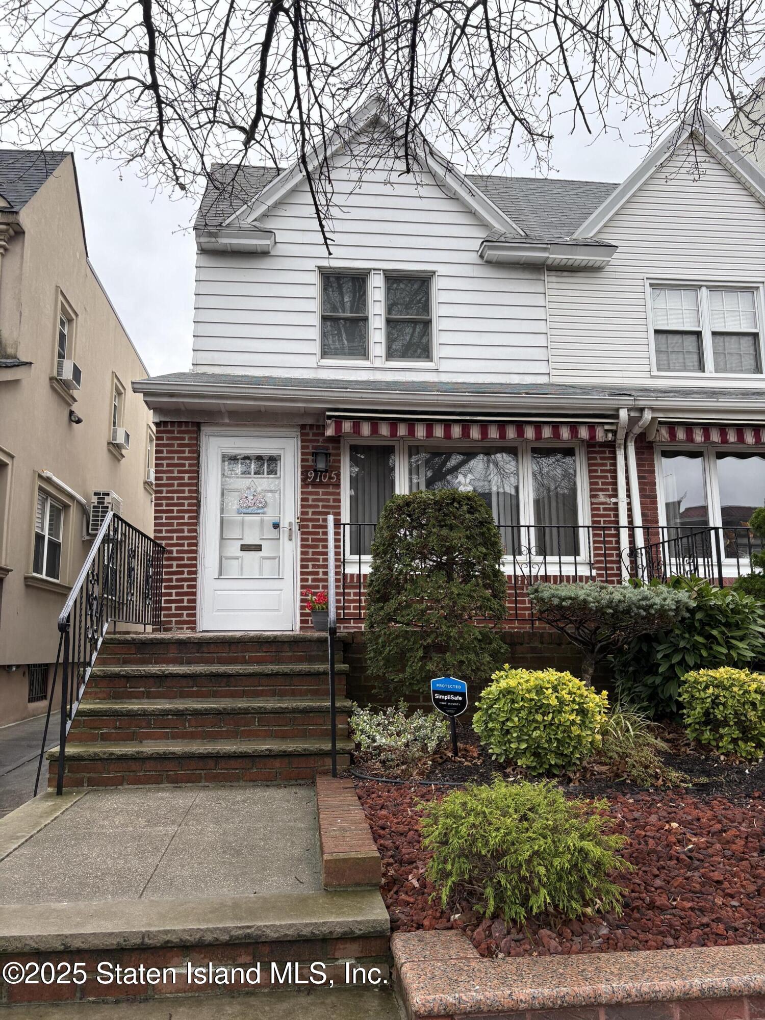 9105 Ridge Boulevard Brooklyn, NY 11209 - Photo 1 of 12 a front view of a house with a yard