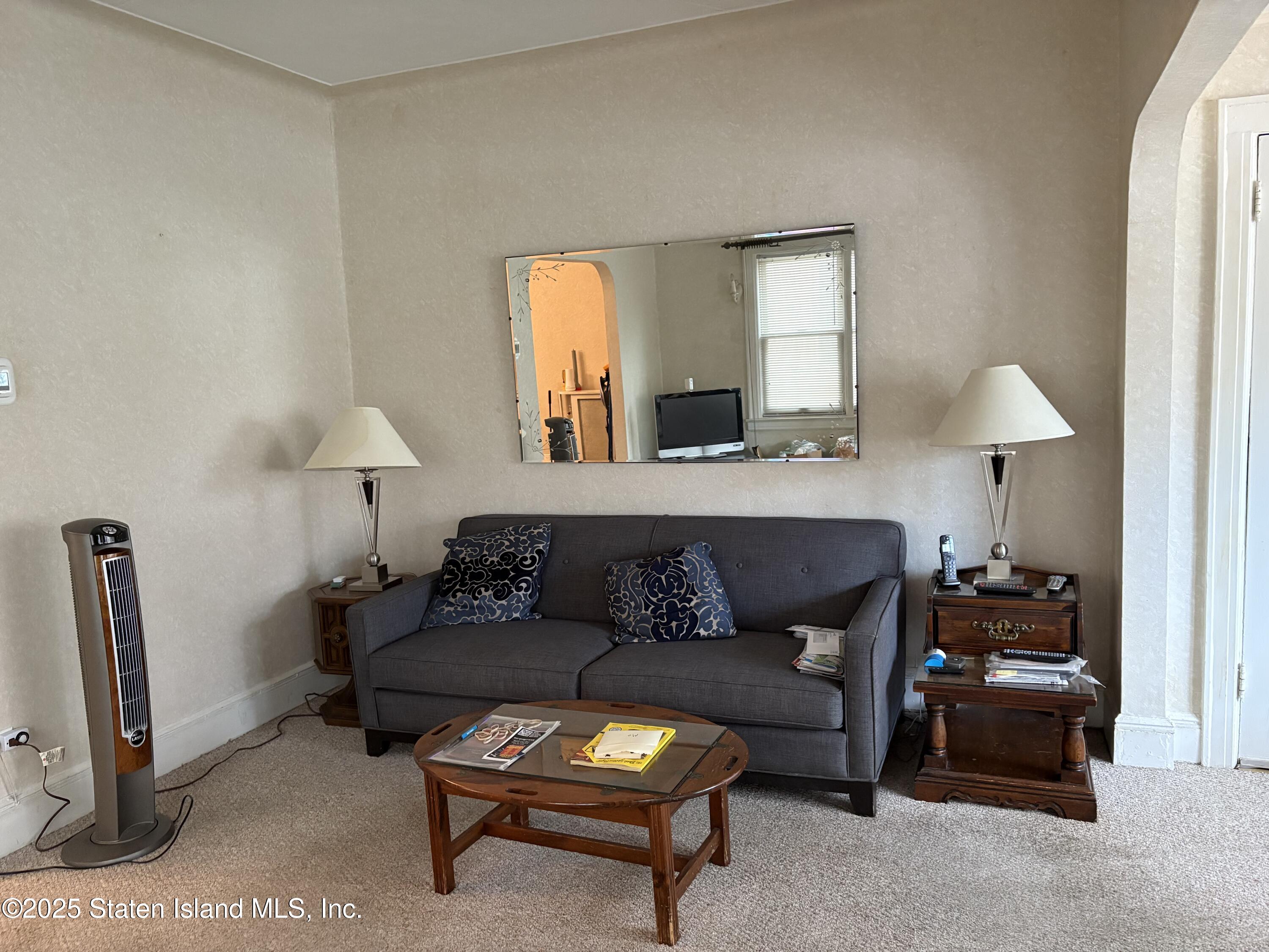 9105 Ridge Boulevard Brooklyn, NY 11209 - Photo 3 of 12 a living room with furniture and a lamp
