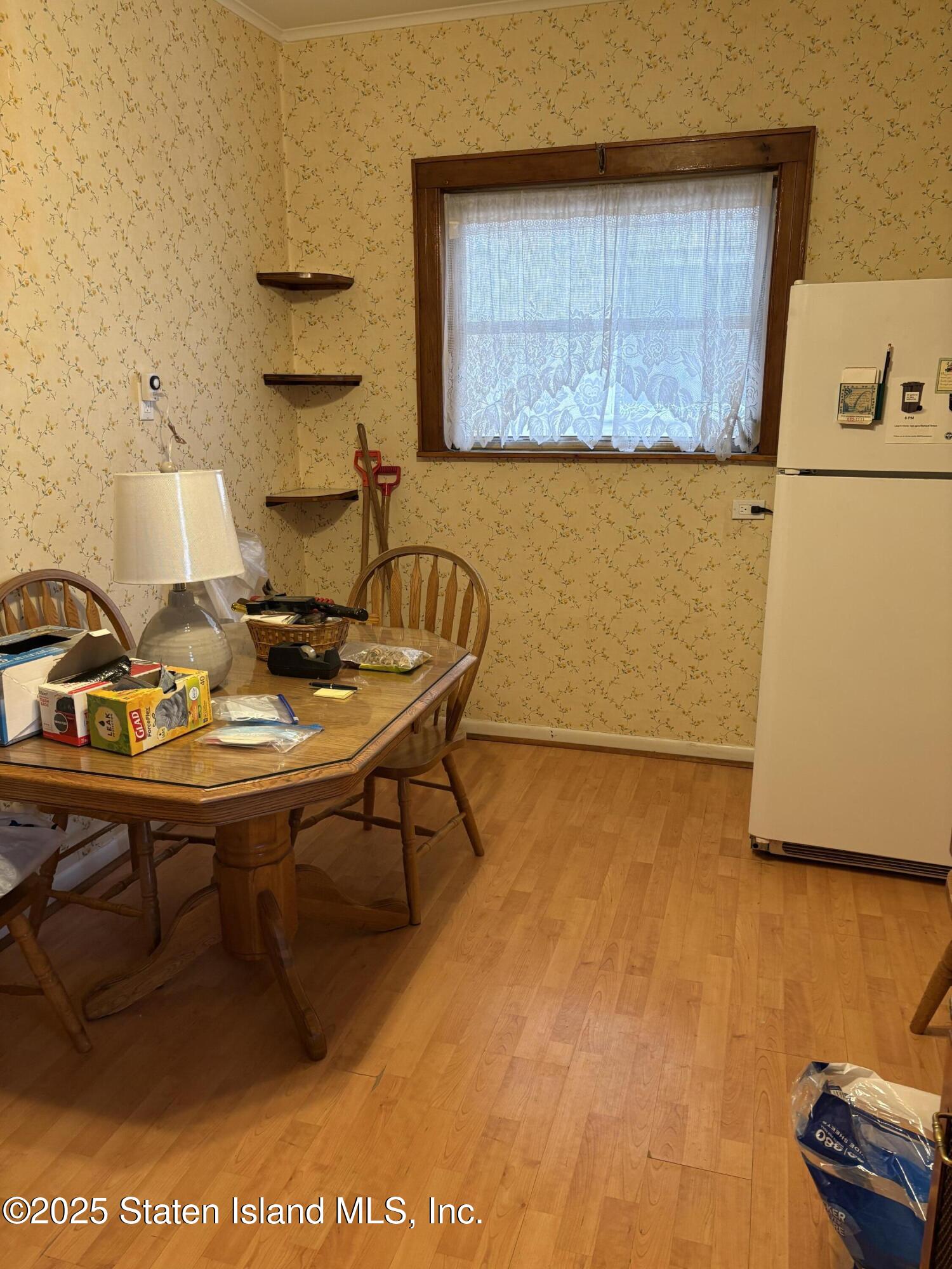 9105 Ridge Boulevard Brooklyn, NY 11209 - Photo 7 of 12 a living room with a table and a couch